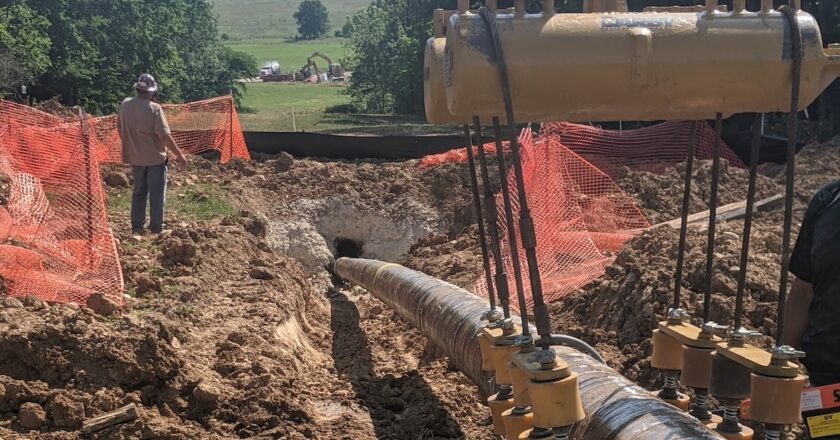 Pipeline being prepared for trenchless installation with mechanical coating protection.